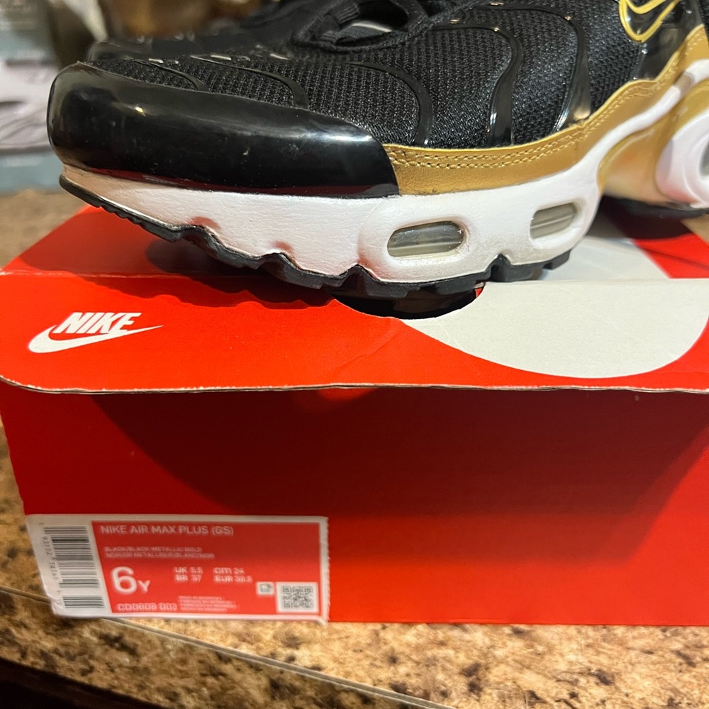 Nike Air Max Plus Black and Gold Sneakers